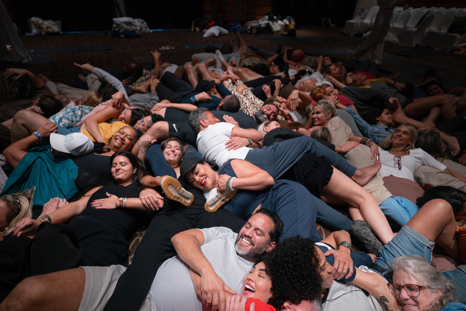 Guests laughing together at an Alchemize gathering