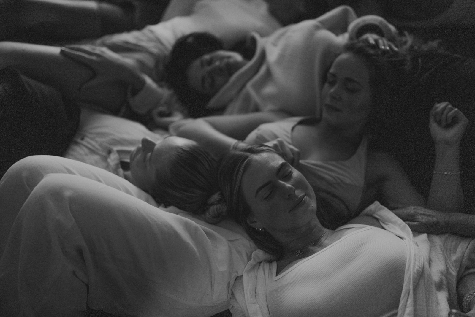 Guests resting together with eyes closed